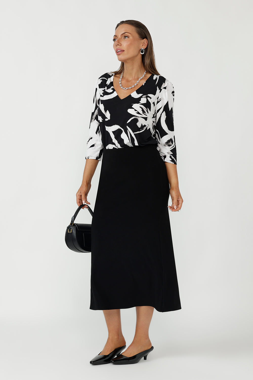 Designed and made in Australia, the Vida Top in Infinity is a versatile wardrobe staple crafted from soft stretch jersey. With a tailored silhouette, 3/4 sleeves, and refined detailing, it’s perfect for comfortable office wear and effortless styling.