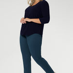 The Vida Top enhances curves with a smooth, tailored fit that feels as good as it looks. Seen from the back, the clean lines and elegant drape showcase its versatility and timeless appeal. Proudly made in Australia and available in inclusive sizes 8 to 24, the Vida Top is a must-have staple for every modern, confident woman.