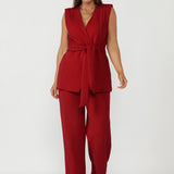 Structured red vest for women with extended shoulders and sculpted fit, modern workwear and occasion layering