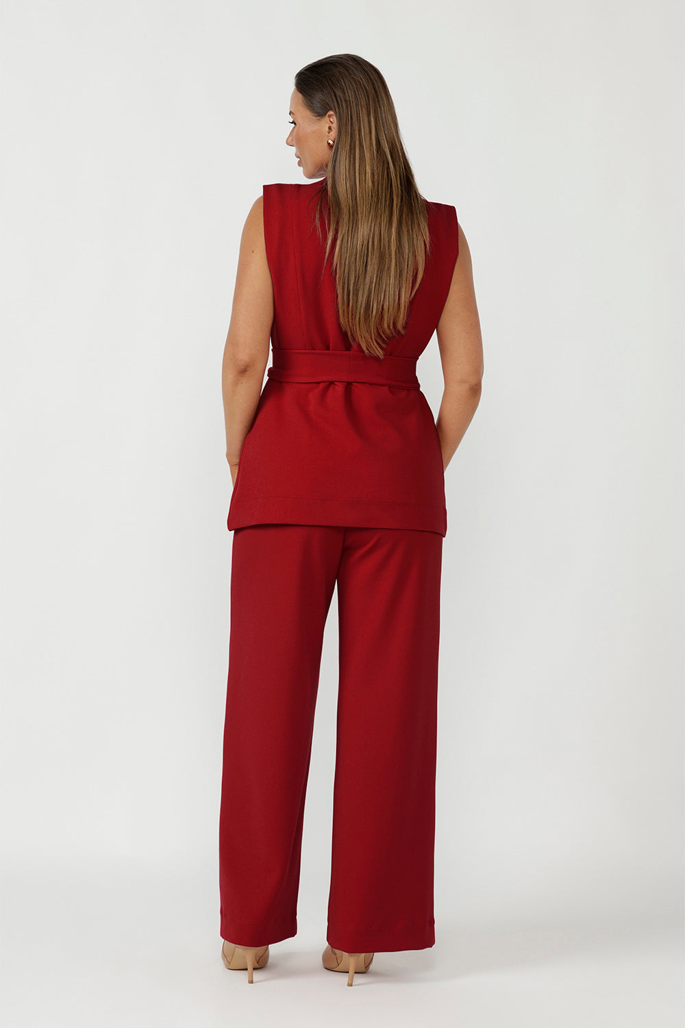 Luxe red women’s vest with sharp tailoring, double-breasted closure and soft stretch fabric for office to evening wear.