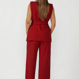 Luxe red women’s vest with sharp tailoring, double-breasted closure and soft stretch fabric for office to evening wear.