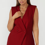 Tailored women’s vest in red with double-breasted front and removable tie, soft suiting and professional styling