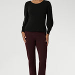 The boat neckline frames the collarbone with subtle sophistication, while tailored bust darts and a close-to-body shape enhance the fit without feeling restrictive. Crafted with attention to detail, the full-length sleeves feature gentle gathers at the shoulder and a wrist dart, adding soft volume and movement—ideal for styling under outerwear without bulk.