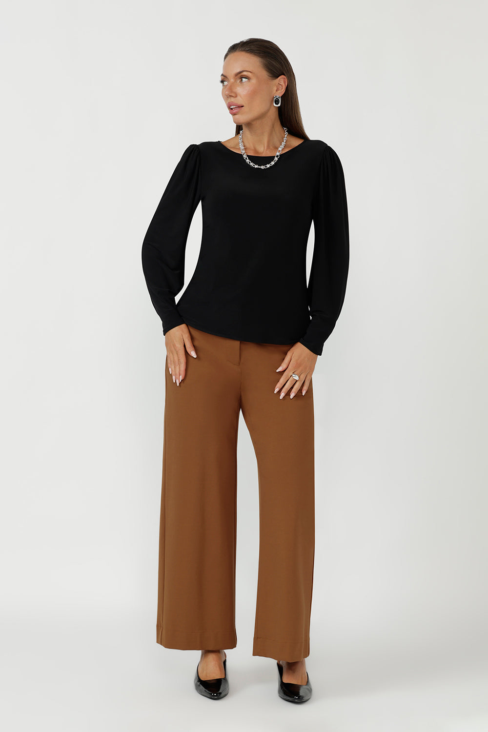 Elevate your everyday wardrobe with the Zara Top in Black, designed in Australia using premium stretch jersey. With a close-to-body fit, soft tailoring, and elegant sleeves, it’s ideal for comfortable office wear and day-to-night dressing.