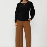 A modern essential for soft tailoring for women, the Zara Top in Black features a boat neckline, subtle shaping, and full-length bellow sleeves. Designed for real bodies in sizes 8–24, it offers a flattering fit from workwear to weekend.
