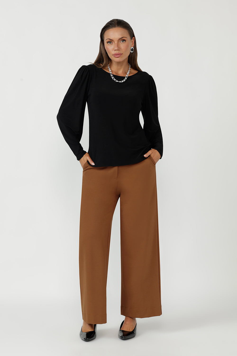 Designed and made in Australia, the Zara Top in Black is a timeless wardrobe essential crafted from premium dry-touch jersey. With a flattering shape, statement sleeves, and inclusive sizing (8–24), it’s perfect for comfortable office wear and modern styling.