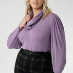 This Lilac hue adds a touch of colour to grey days, pairing effortlessly. Plus size model wears her Lilac Top with plaid printed pants with tailored wide leg design. 