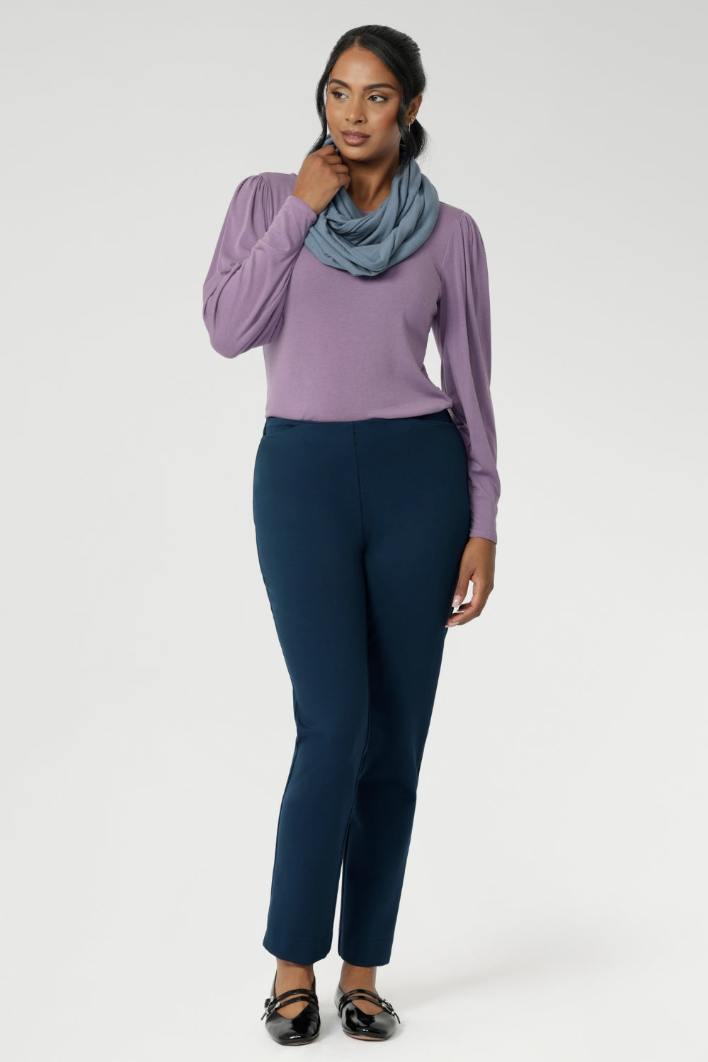The tailored bust darts and close-to-body silhouette offer a sleek yet relaxed fit, while the straight front hem and gently curved longer back hem add a modern finish. This soothing lilac colour effortlessly pairs with LF Garcia jackets or Sorel Trenchcoats with matching Infinity scarf for a complete look. Made in Australia and available in sizes 8 to 24