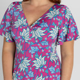 printed maxi dress with flutter sleeves and deep ruffle at the hem